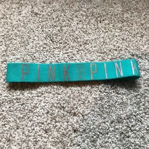 A blue PINK headband